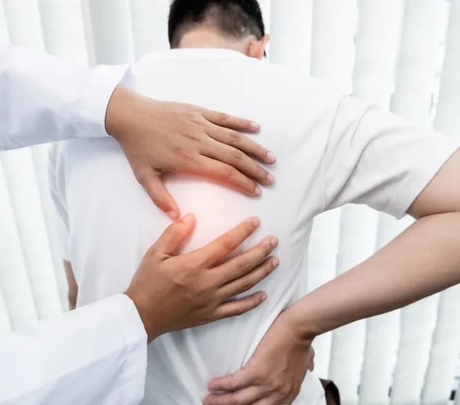 Doctor examining back pain